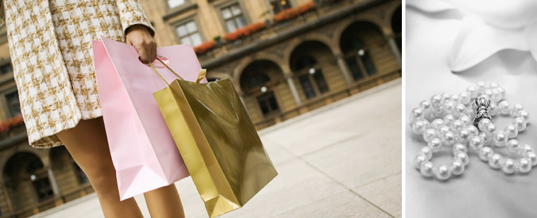 woman with shopping bags and pearls